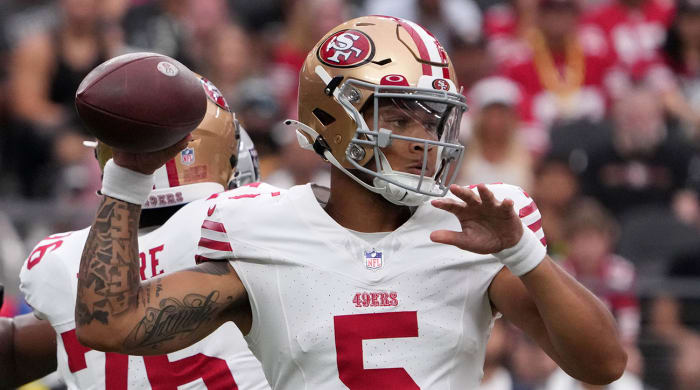 Trey Lance throws a pass for the 49ers